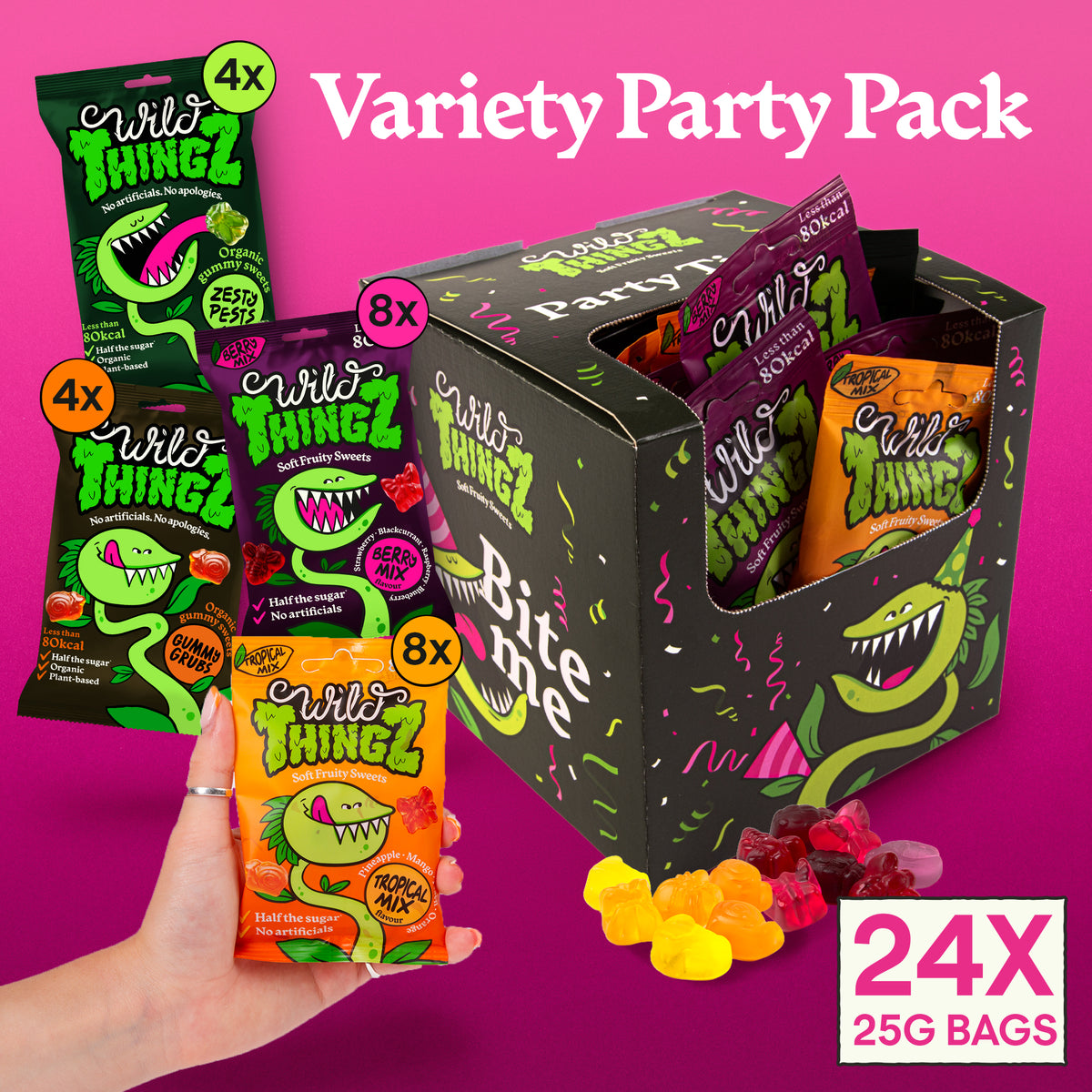 Hand holding a Tropical Mix bag in front of the open Variety Party Pack showing the mix of 24 bags