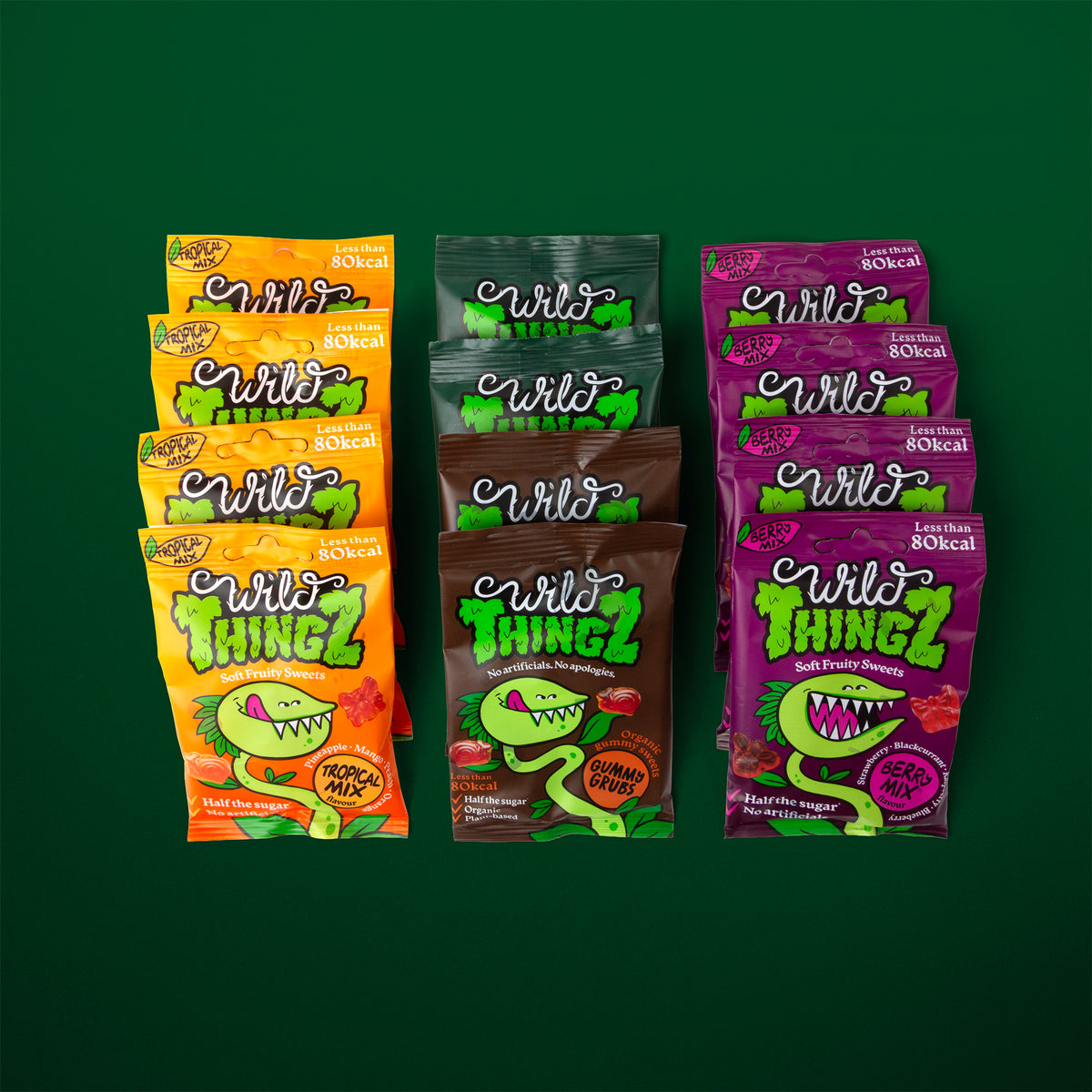 Rows of Wild Thingz bags in all four flavours laid out on a dark green background