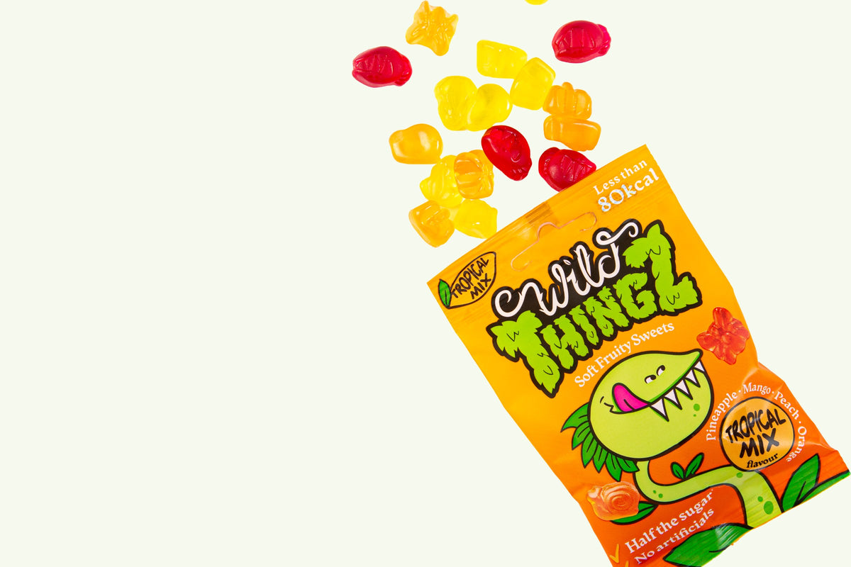 A bag of Wild Thingz Tropical Mix with soft fruity gummies spilling out